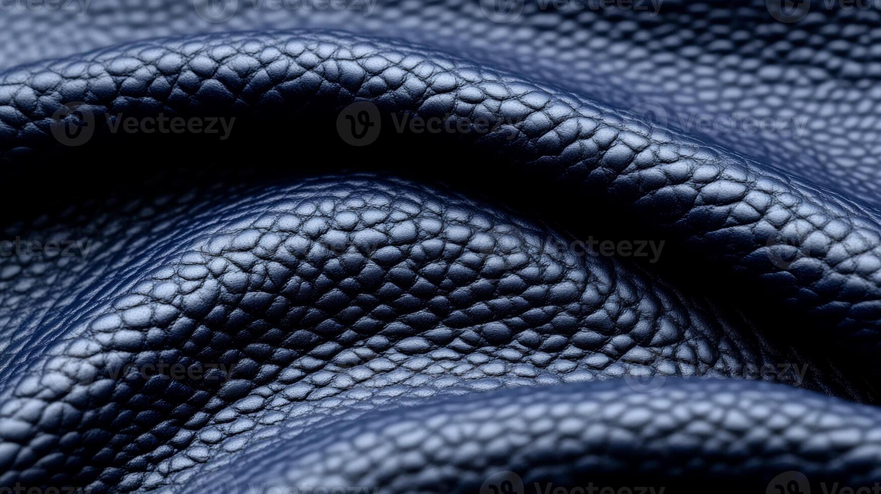 Closeup of deep indigo leather with a matte texture and fine lines capturing the depth of winter twilight photo