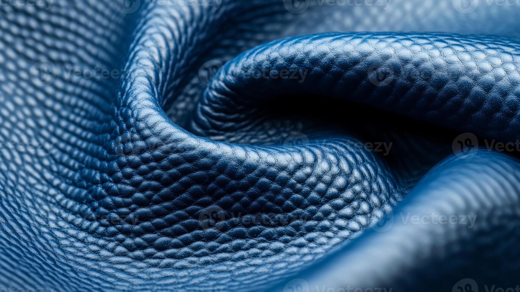 Closeup of frosty blue leather with a subtle fine grain texture and a cool matte finish evoking a winter chill photo