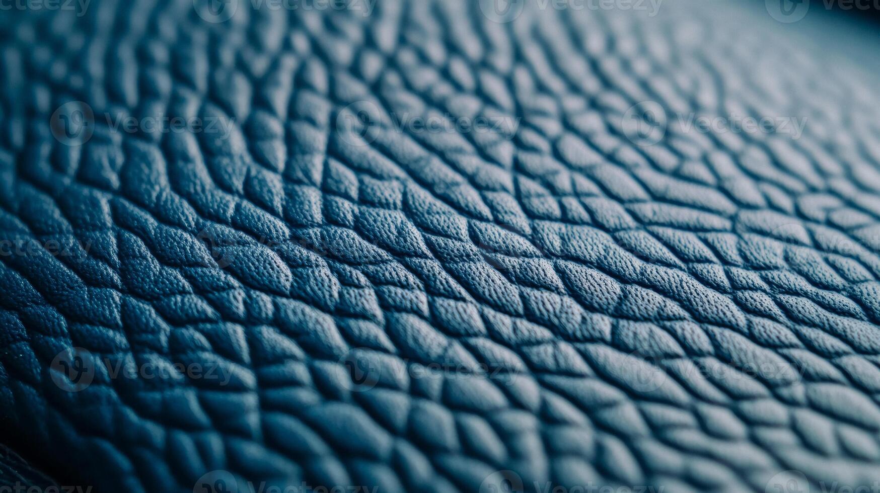 Closeup of frosty blue leather with a subtle fine grain texture and a cool matte finish evoking a winter chill photo