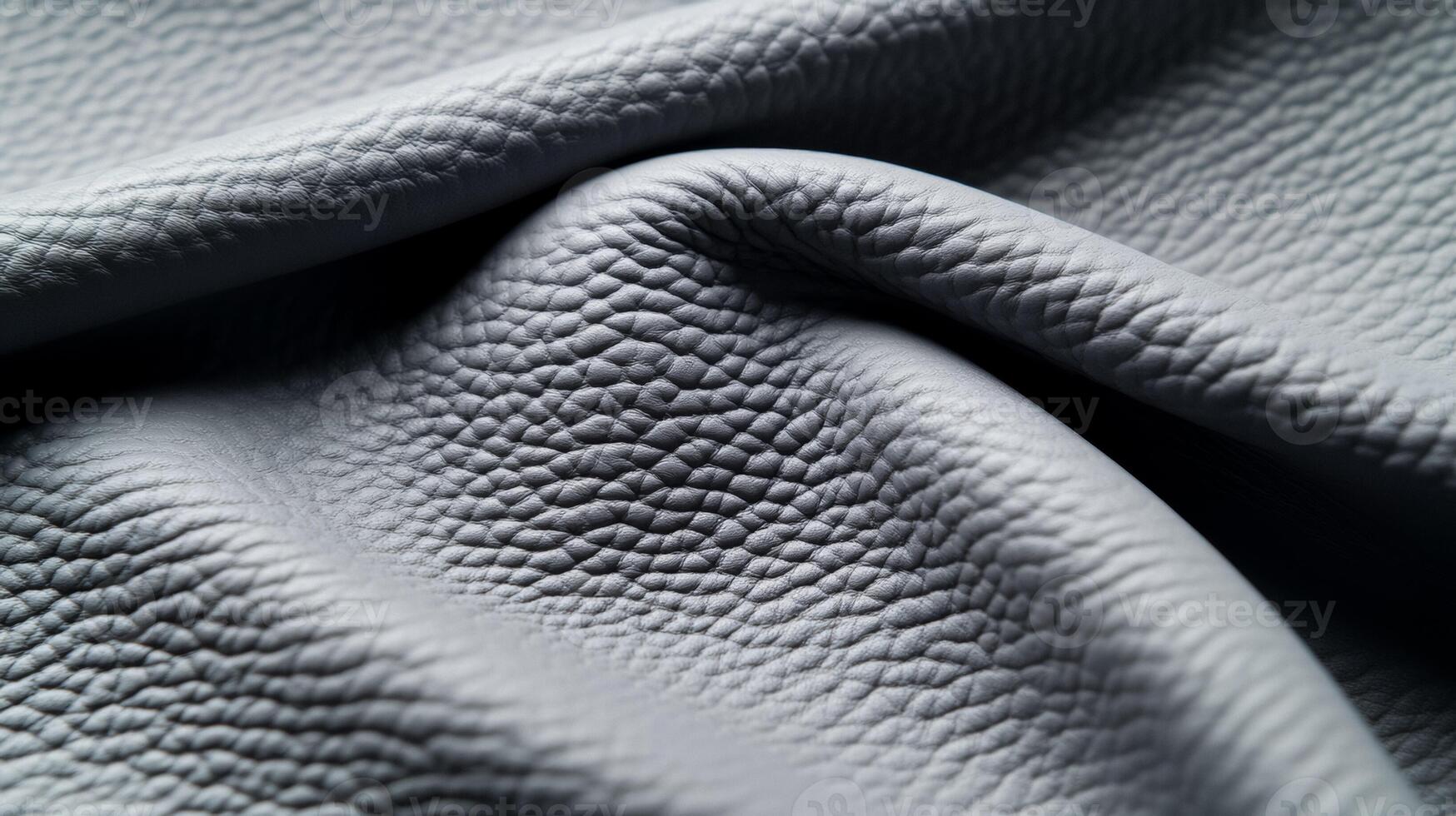 Closeup of muted winter grey leather with a fine grain and matte finish conveying the calmness of a snow covered field photo