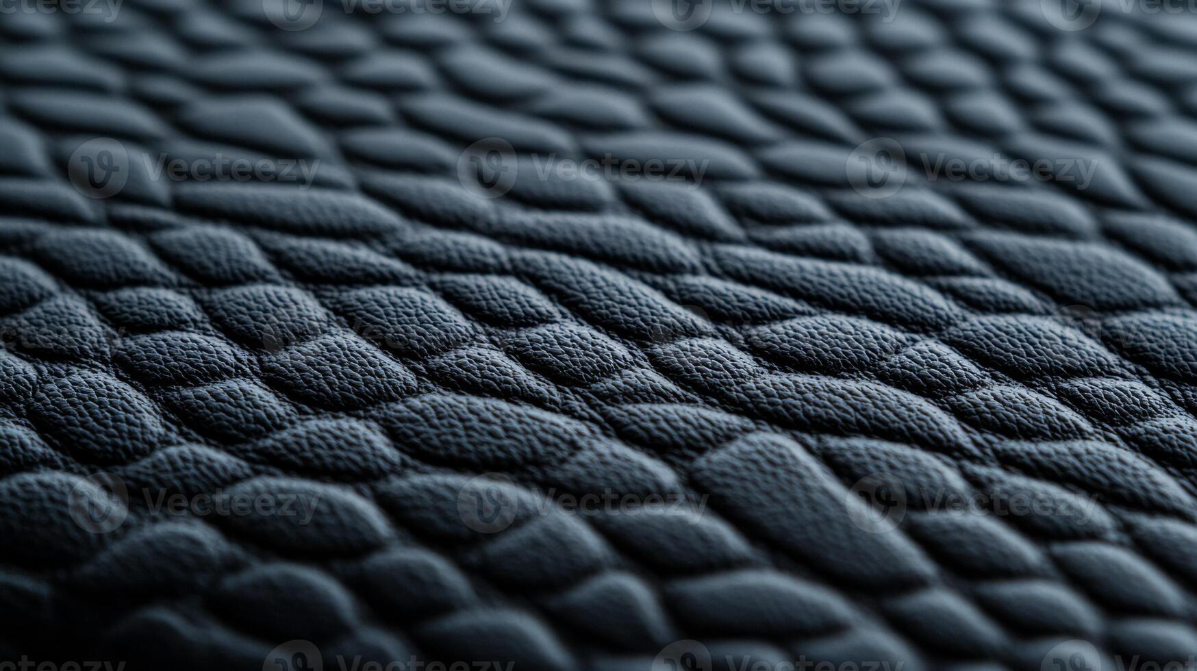 Deep charcoal grey leather with a subtle pebble grain and a slightly distressed surface in a detailed macro view photo