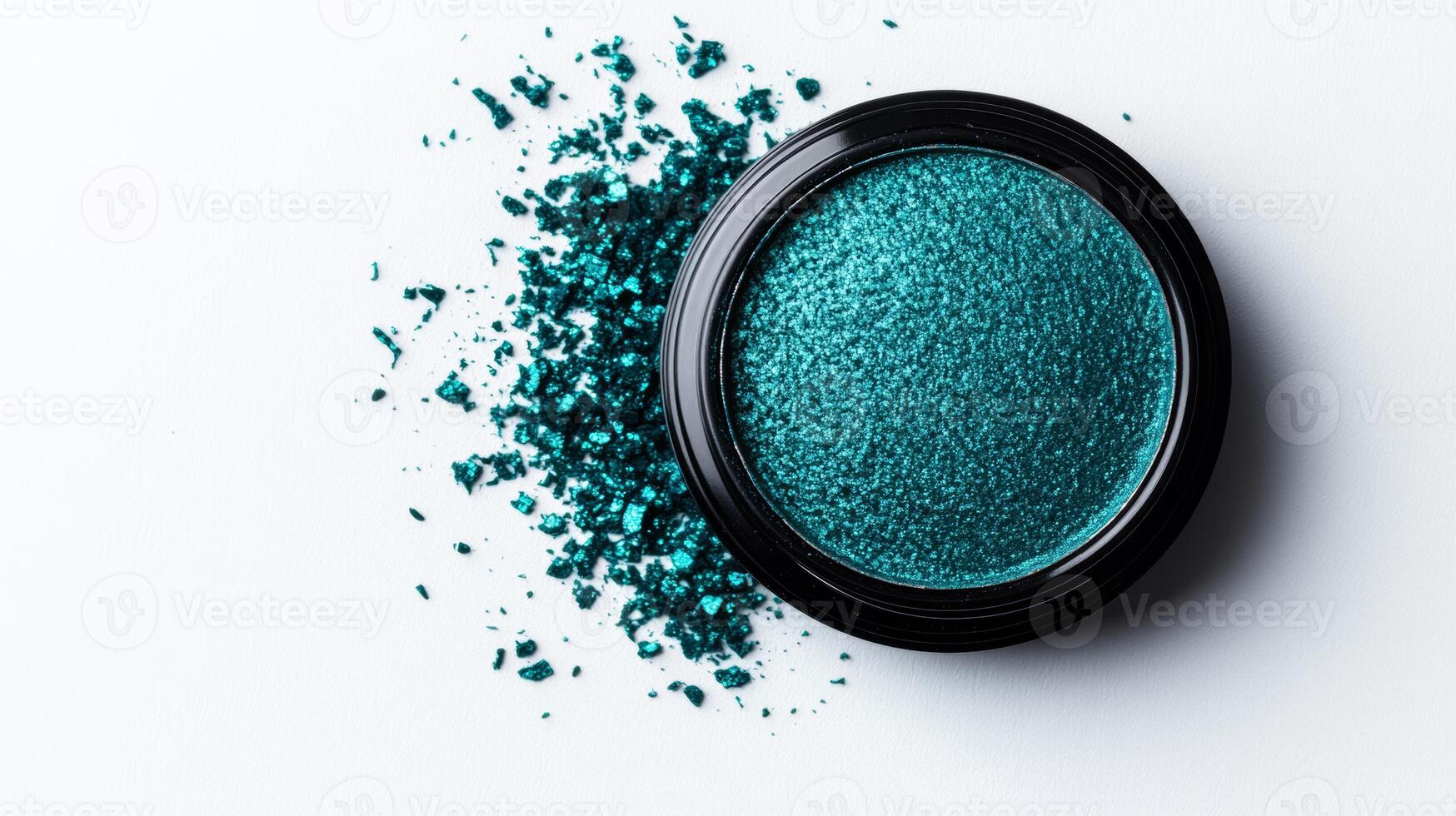 Deep icy teal eyeshadow with a metallic finish creating a sparkling contrast against a frosty white background photo