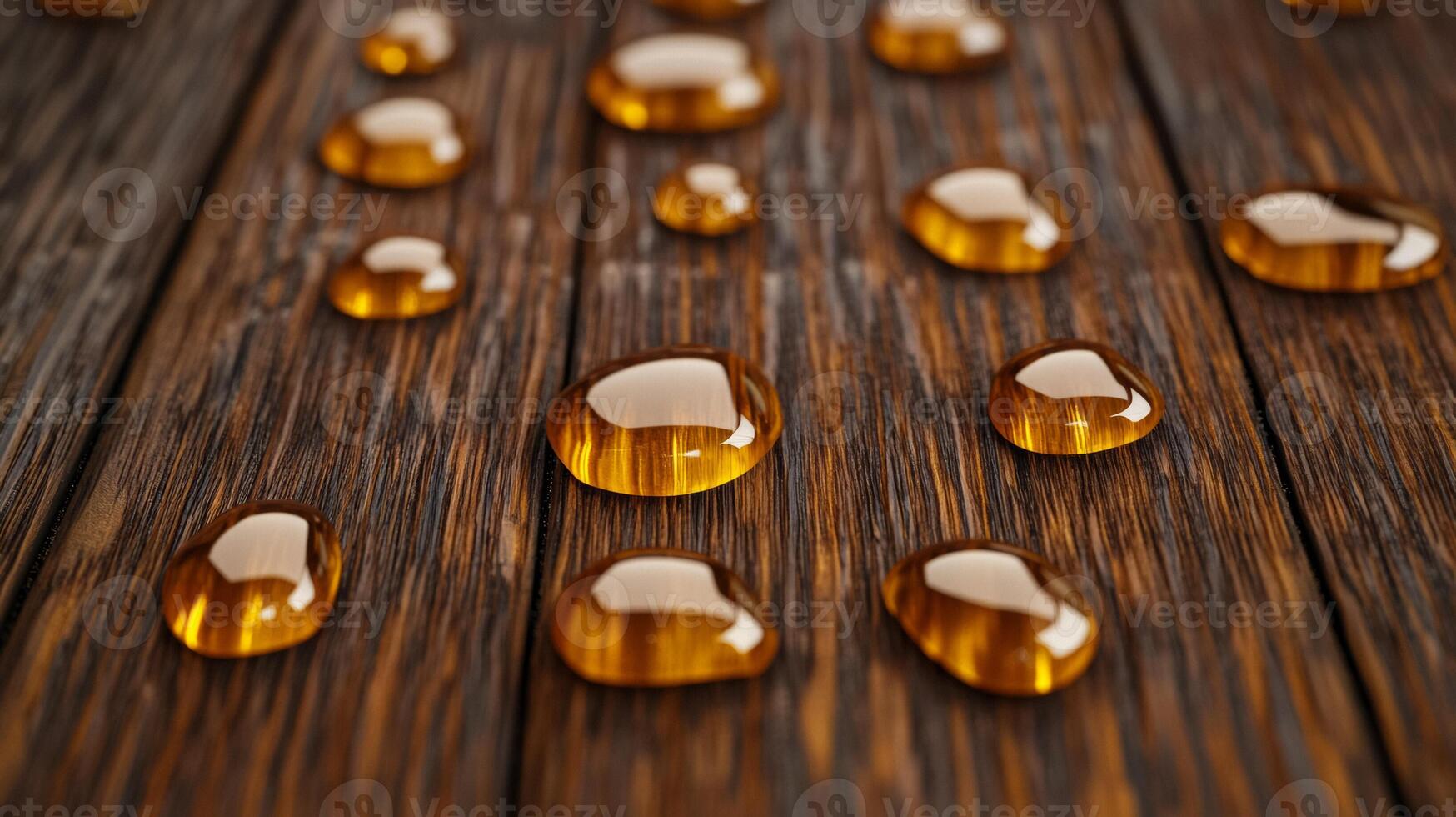 Droplets of bronze serum oil on a dark brown wooden surface capturing the essence of autumn warmth photo
