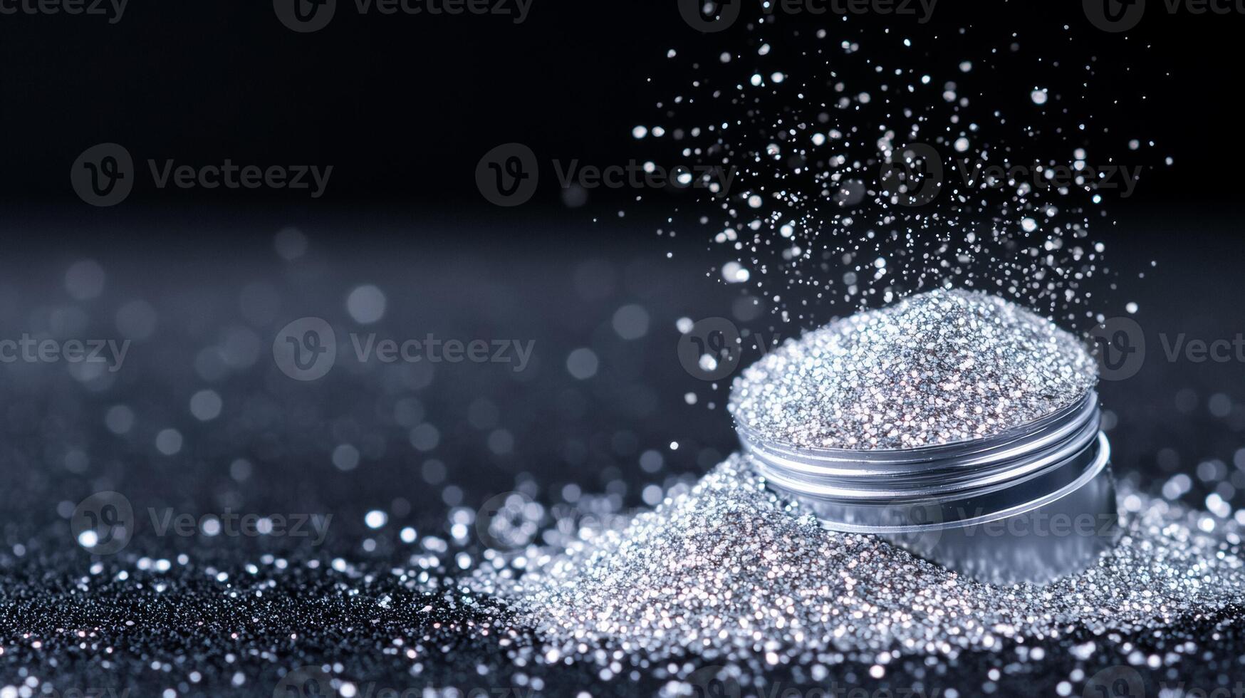 Glittering silver eyeshadow powder spread with uneven texture on a black velvet background twinkling under direct light photo