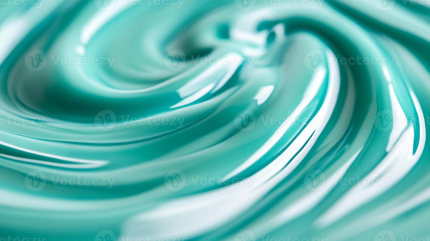 Macro shot of swirling blue and green marbled nail polish blending into fluid abstract waves with a glossy finish photo