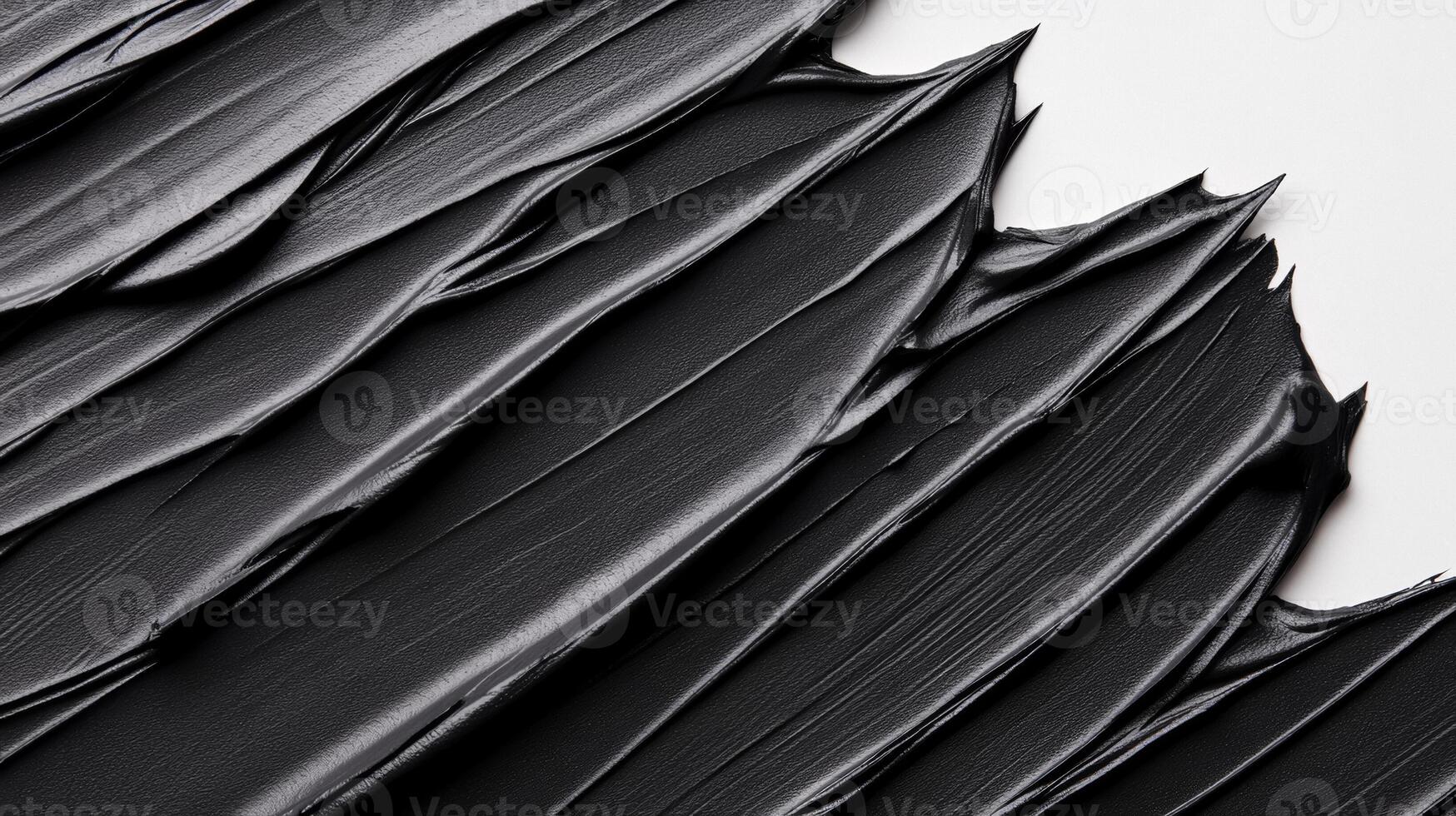 Matte black cosmetic clay mask spread in smooth thick lines on a stark white background with subtle texture photo