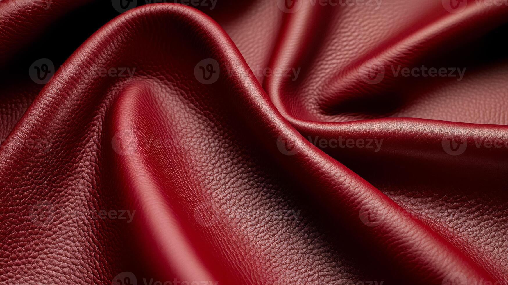 Rich burgundy leather in a macro shot showing smooth texture with fine wrinkles and a deep color gradient photo
