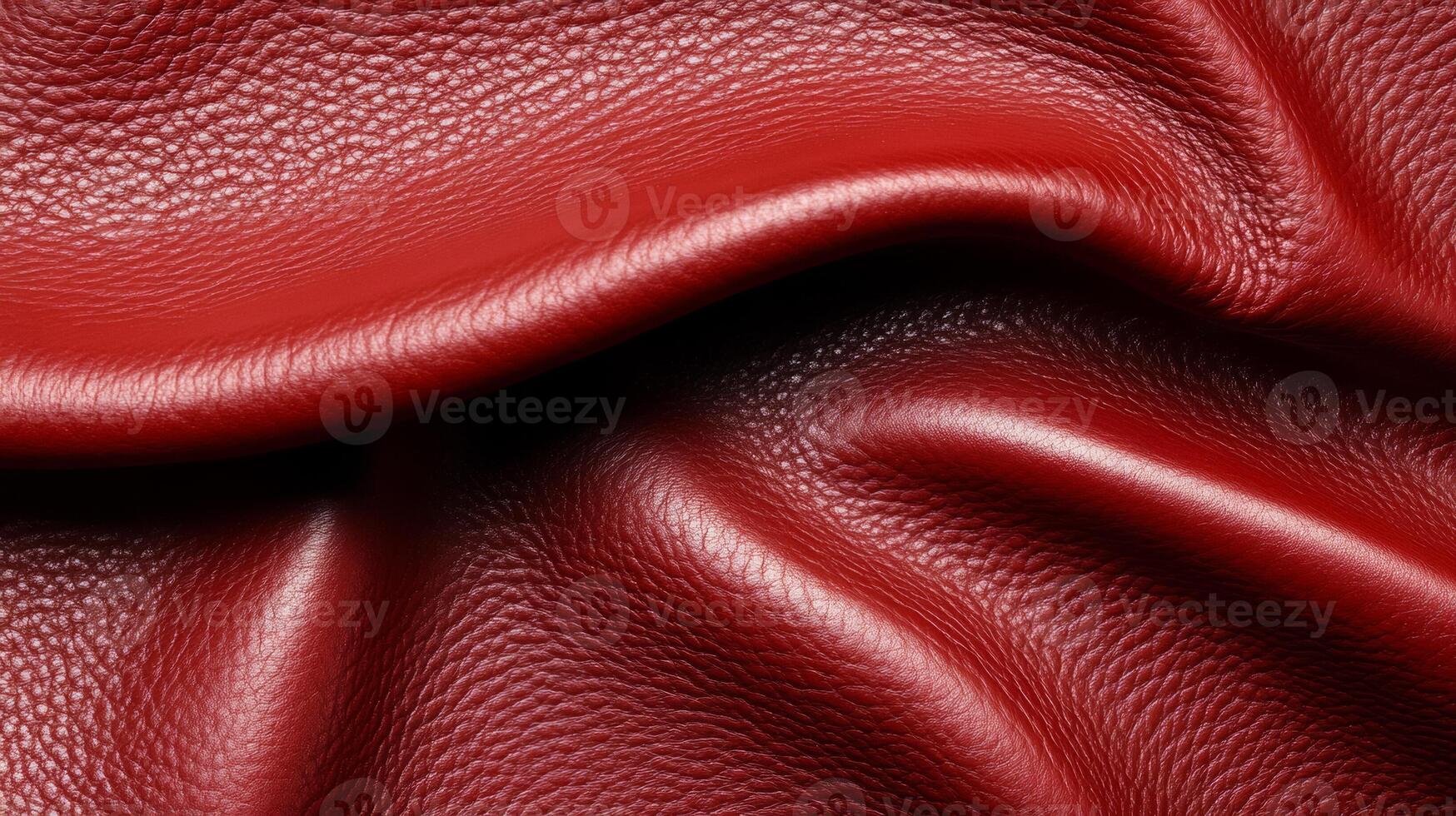 Rich burgundy leather in a macro shot showing smooth texture with fine wrinkles and a deep color gradient photo