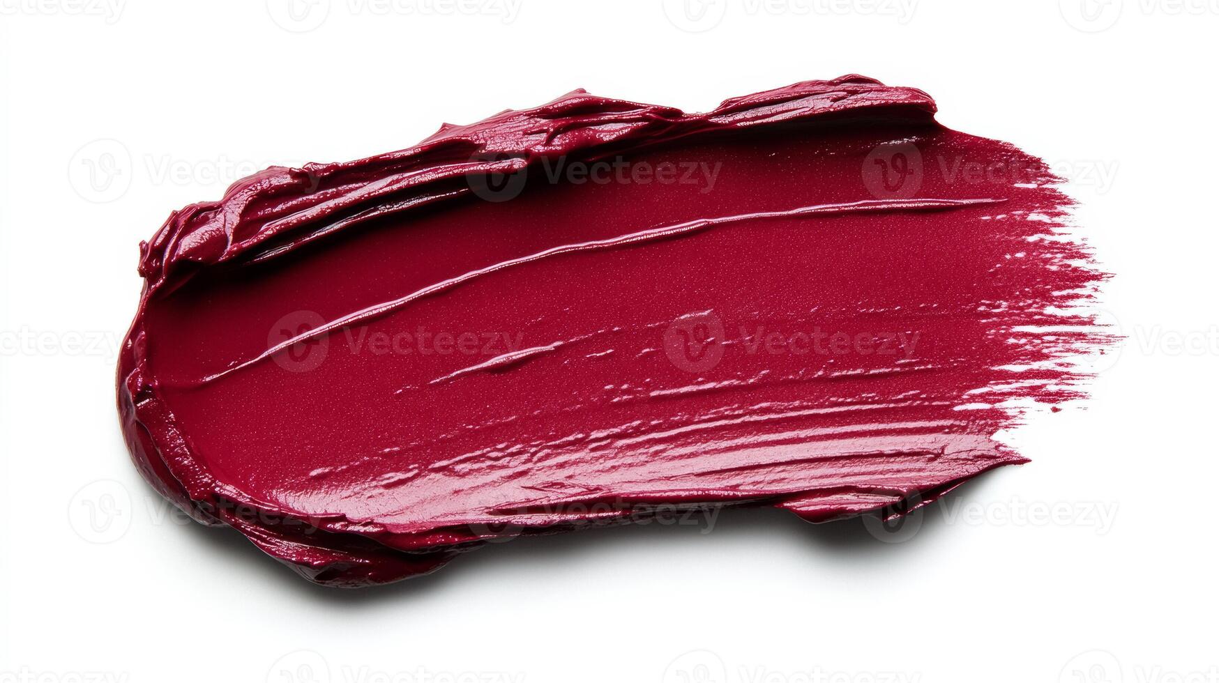 Rich burgundy lipstick smudge with soft feathered edges and glistening highlights on a matte white background photo