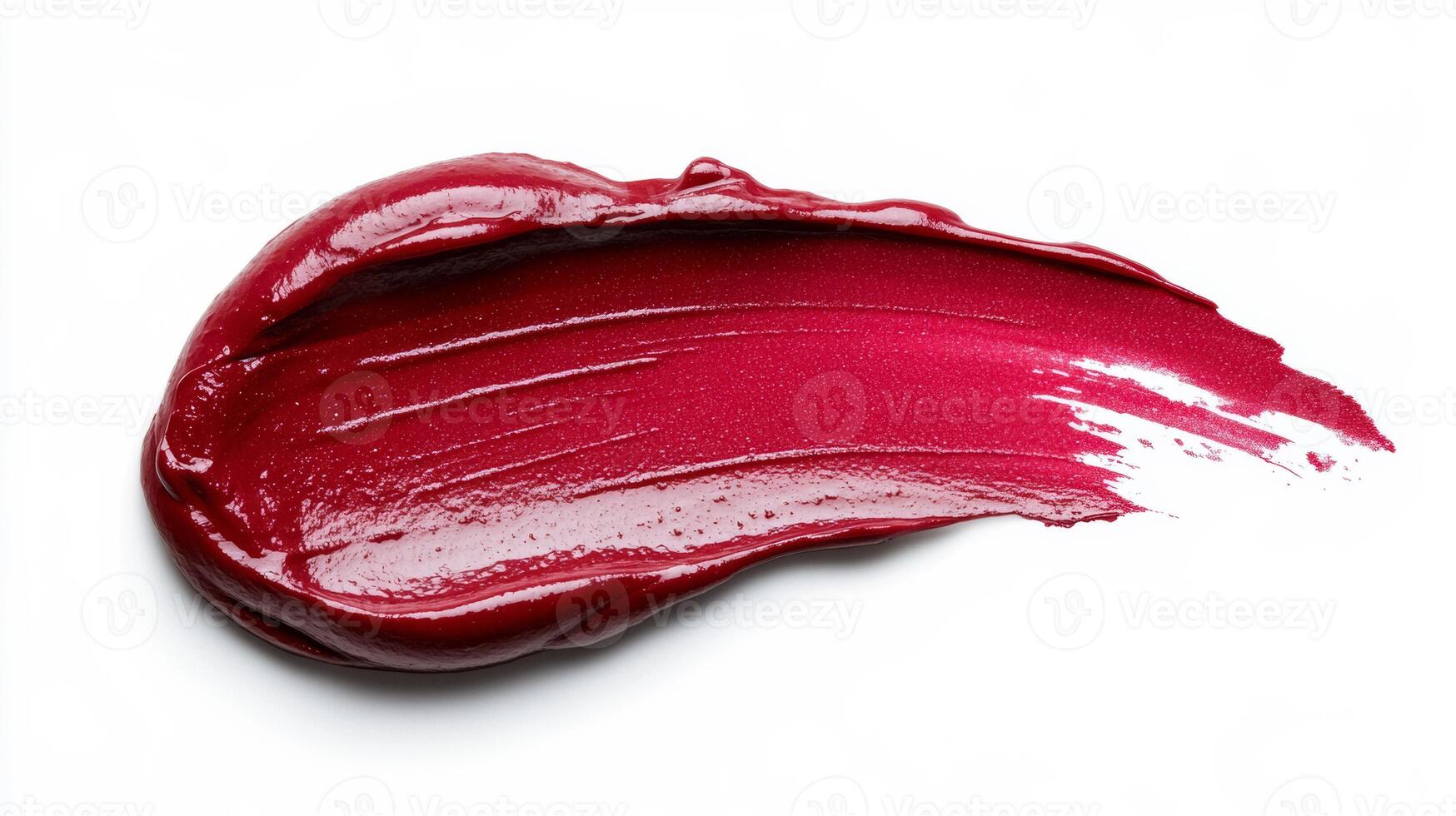 Rich burgundy lipstick smudge with soft feathered edges and glistening highlights on a matte white background photo