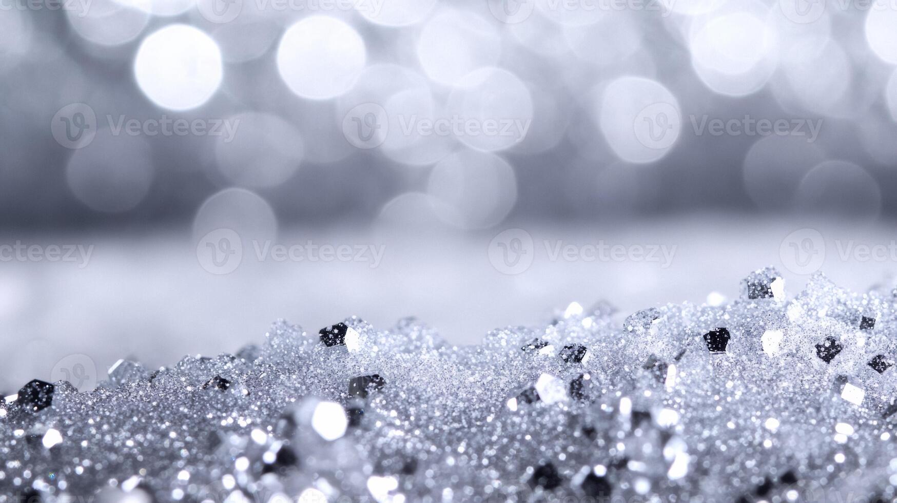 Sparkling white glitter suspended in clear serum resembling fresh snow on a frosty morning against a silver background photo