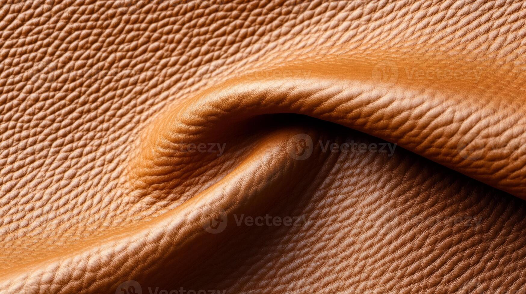 Warm camel leather with a natural textured grain and hints of patina viewed up close photo