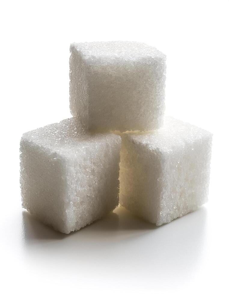 Close-up of three white sugar cubes, isolated on white background photo