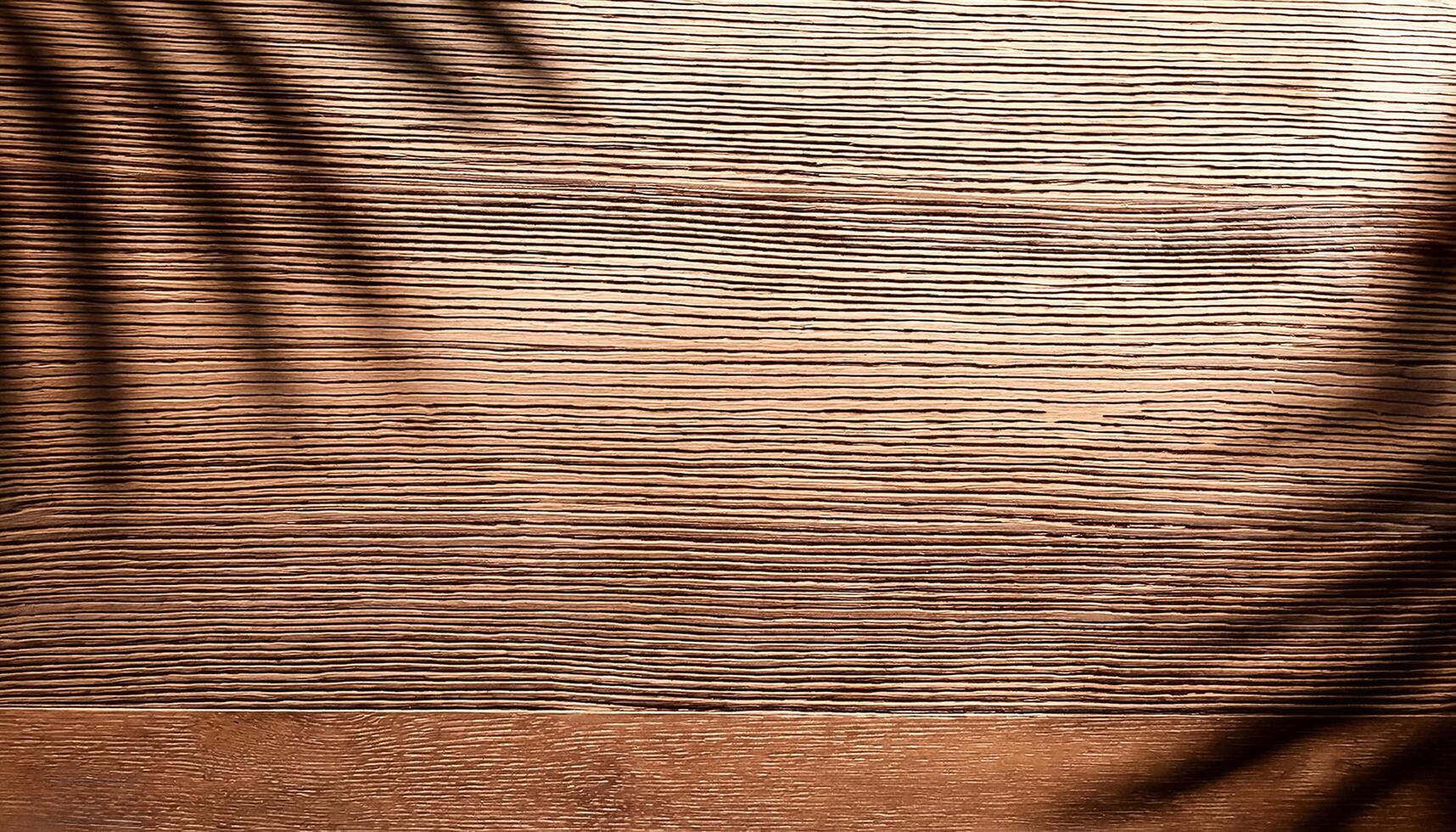 top view of soft brown table with high resolution texture and palm leafs shadows, summer table background with empty space for text or design, soft cozy sunny table backdrop, wooden texture seamless photo