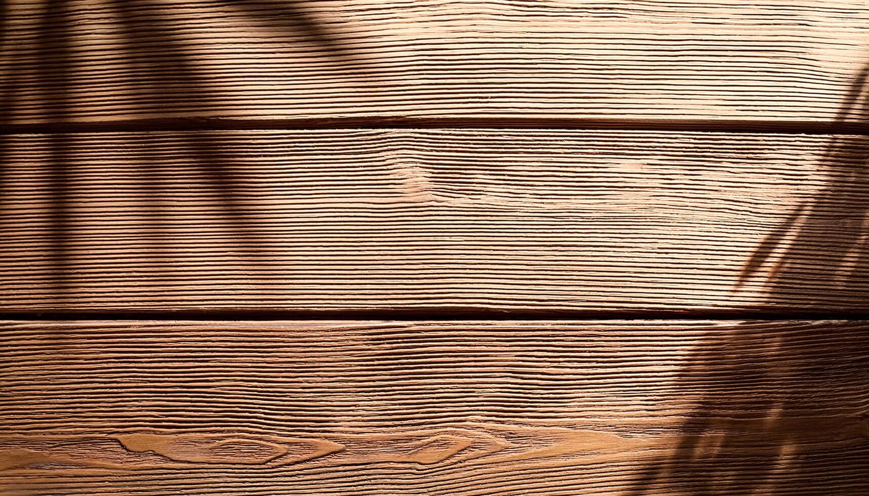 top view of soft brown table with high resolution texture and palm leafs shadows, summer table background with empty space for text or design, soft cozy sunny table backdrop, wooden texture seamless photo