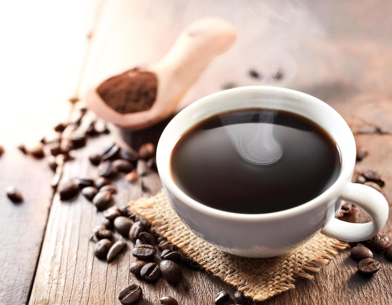 Creative drink concept of Cup of black coffee isolated on dark background photo