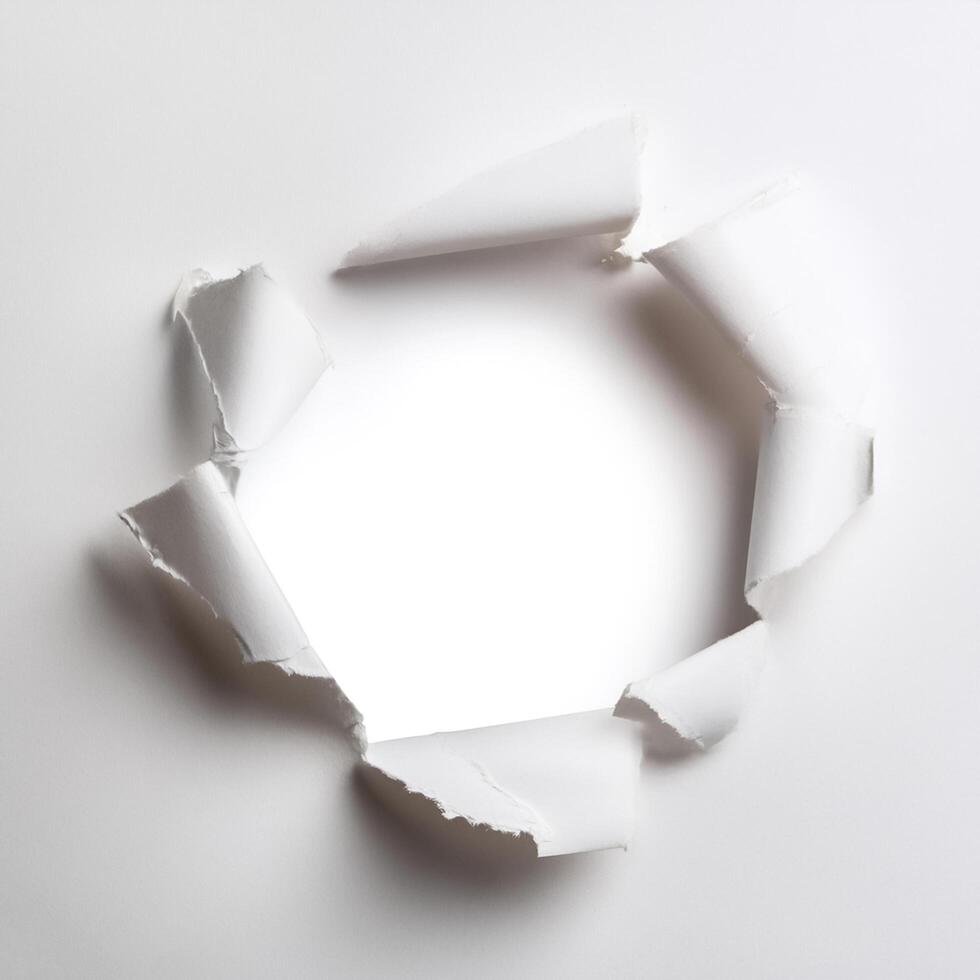 a white paper hole torn photo