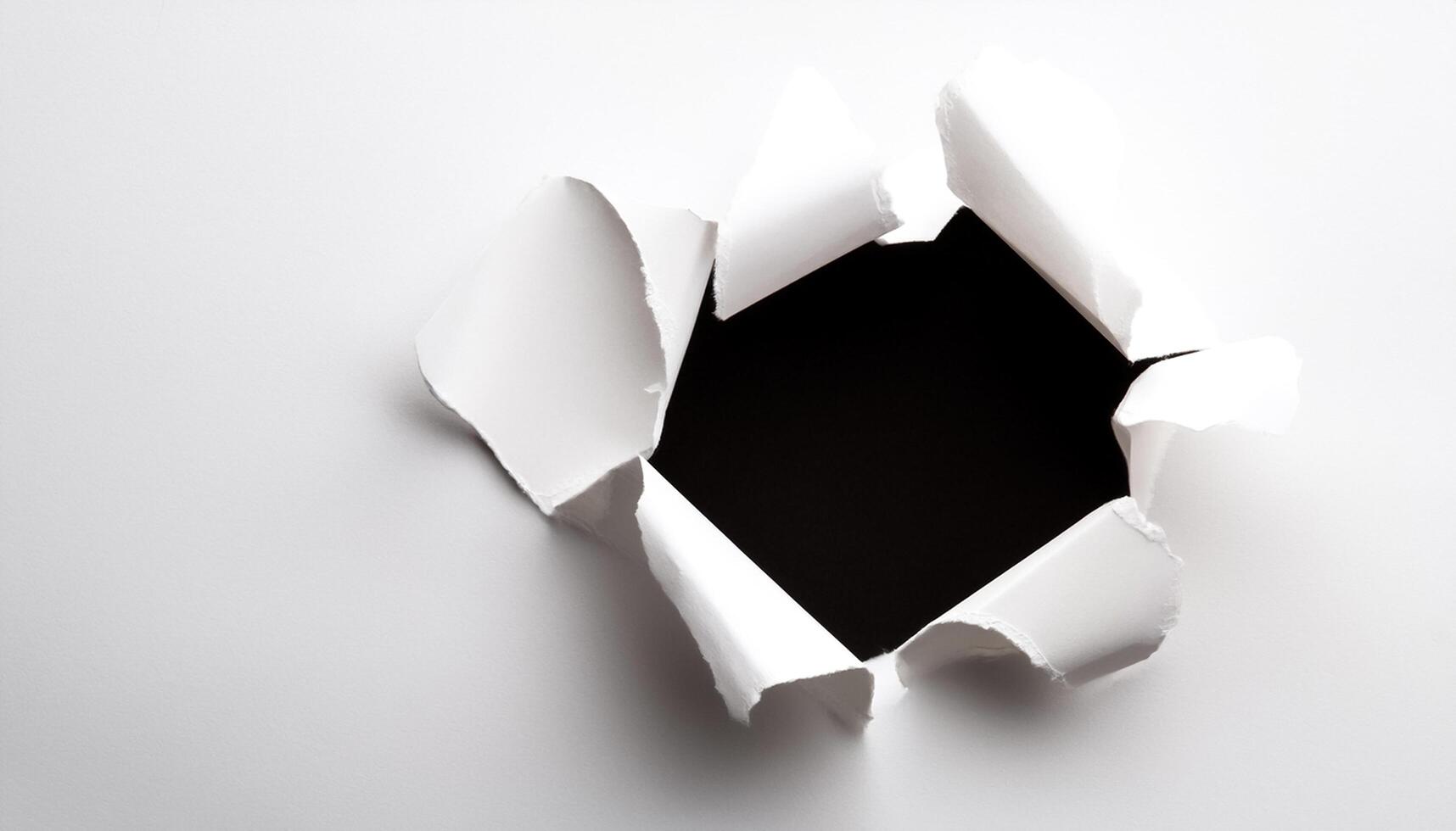 a white paper hole torn photo