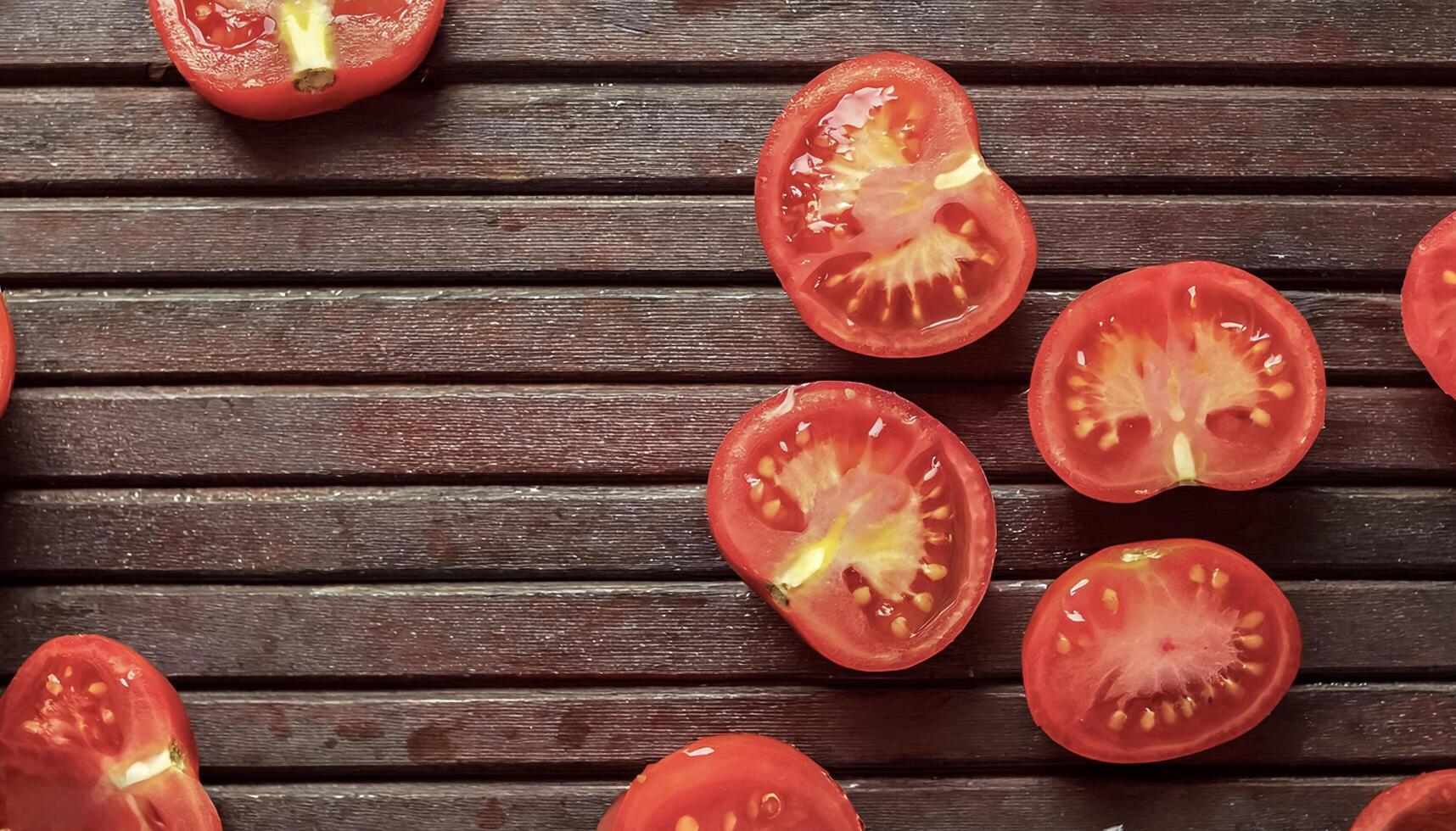 Overhead view of Fresh Ripe juicy red Tomato halves food summer background photo