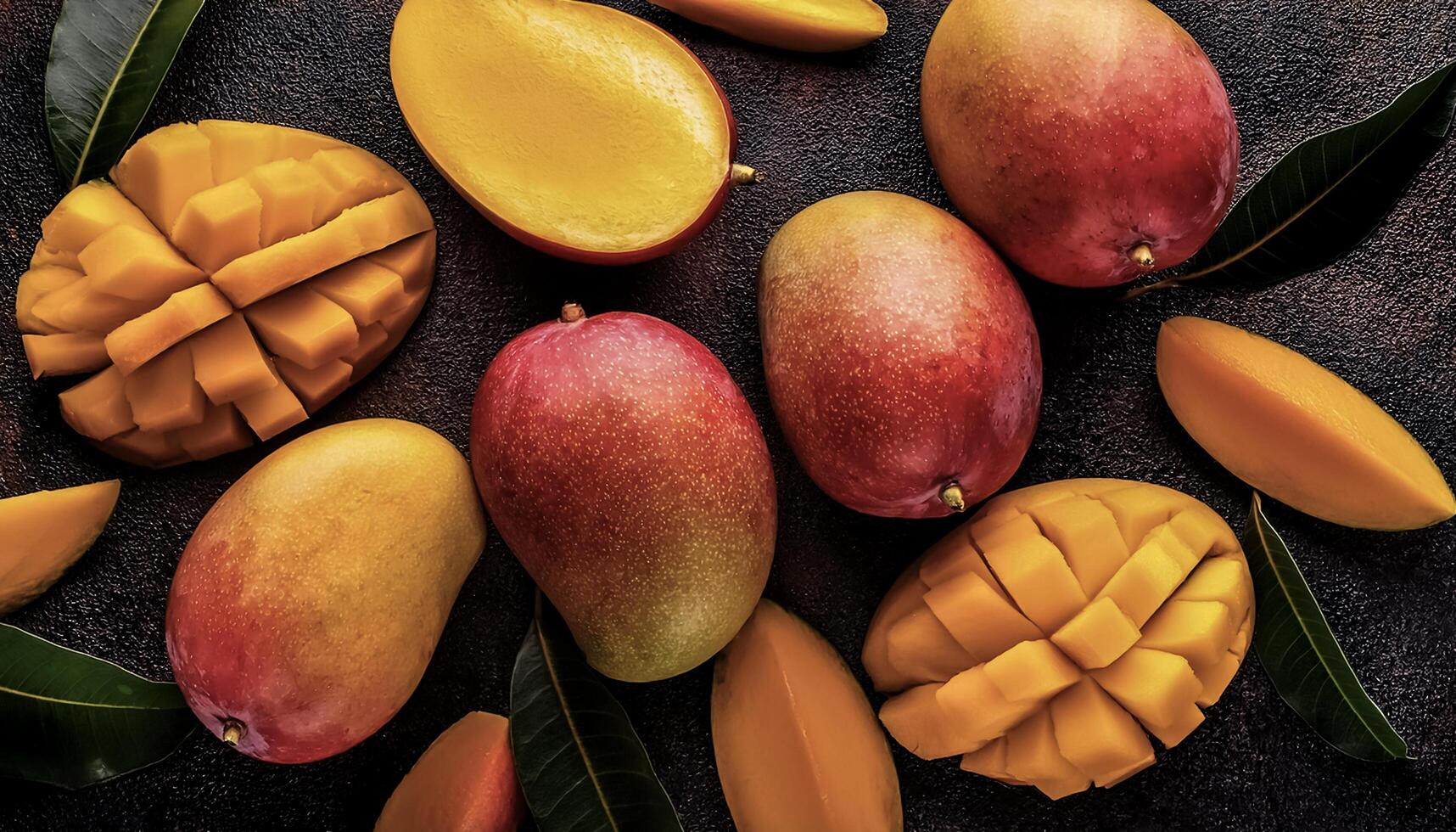 Overhead view of Fresh, Pile, Ripe and juicy sweet mango fruits. Halves food summer background photo