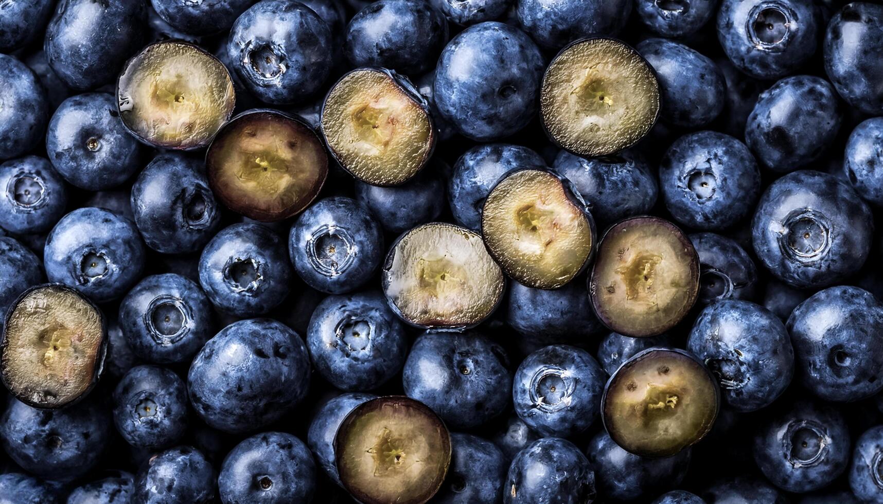 Overhead view of Fresh, Ripe and juicy blueberries. Halves food summer background photo