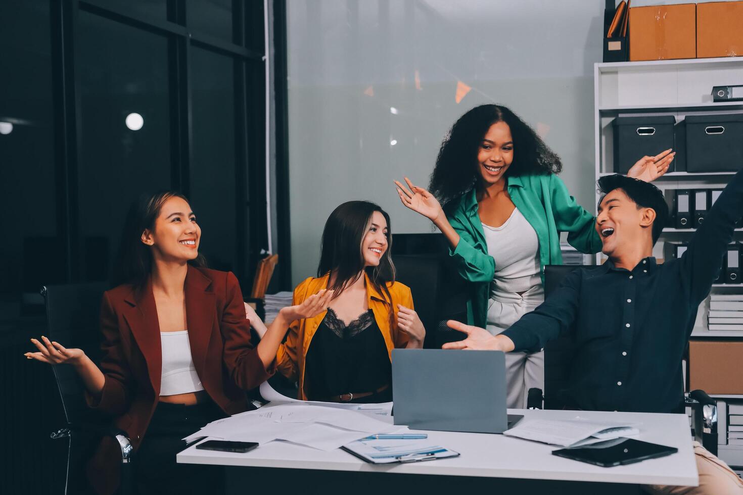 Motivated funny diverse business team people dancing celebrating success at corporate party on friday, happy friendly multiracial coworkers group having fun together enjoy victory dance in office photo