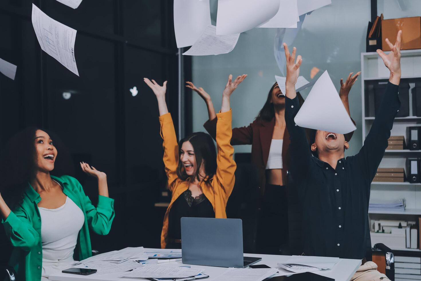 Motivated funny diverse business team people dancing celebrating success at corporate party on friday, happy friendly multiracial coworkers group having fun together enjoy victory dance in office photo