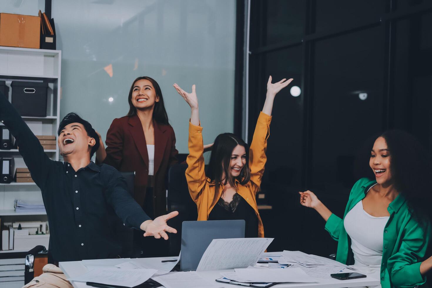 Motivated funny diverse business team people dancing celebrating success at corporate party on friday, happy friendly multiracial coworkers group having fun together enjoy victory dance in office photo