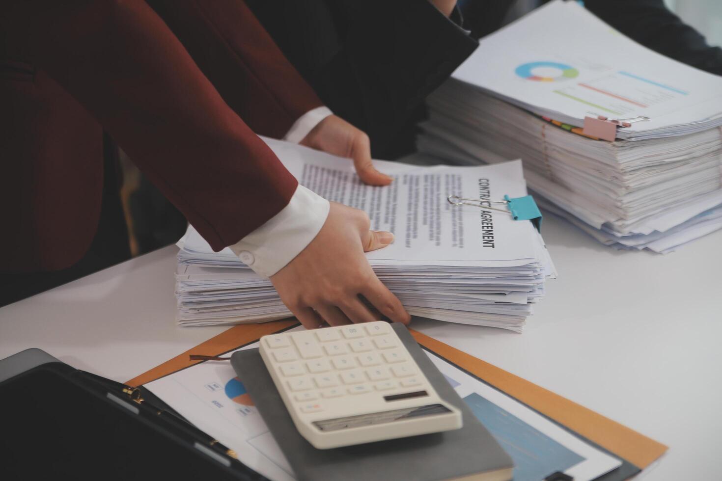 Audit concept,Administrator business man financial inspector and secretary making report calculating balance. Internal Revenue Service checking document. photo