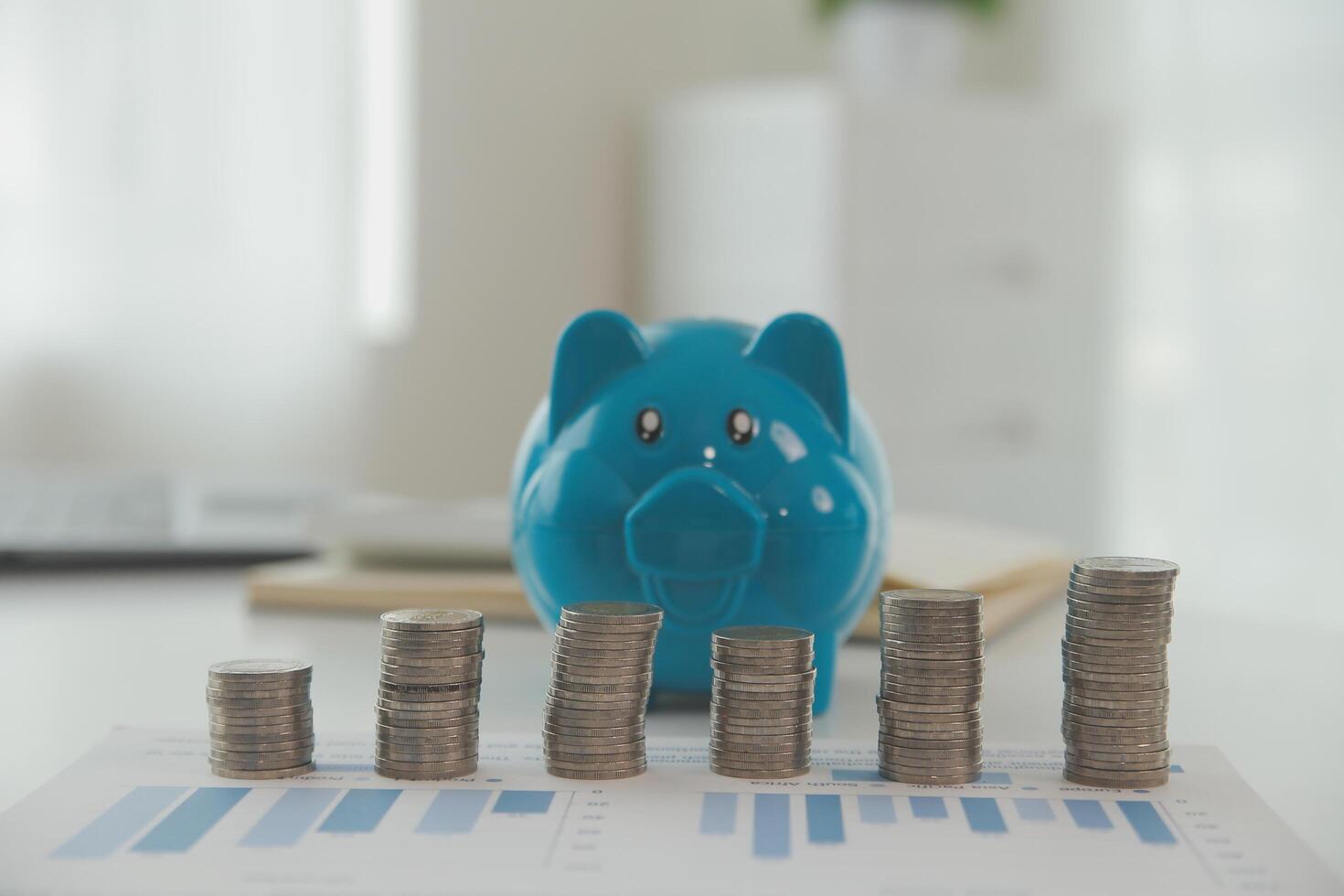 Saving money wealth concept, asian young business woman hand write management budget for saving cost, cash finance planning to spend enough money on her income for save money, payment tax, investing. photo