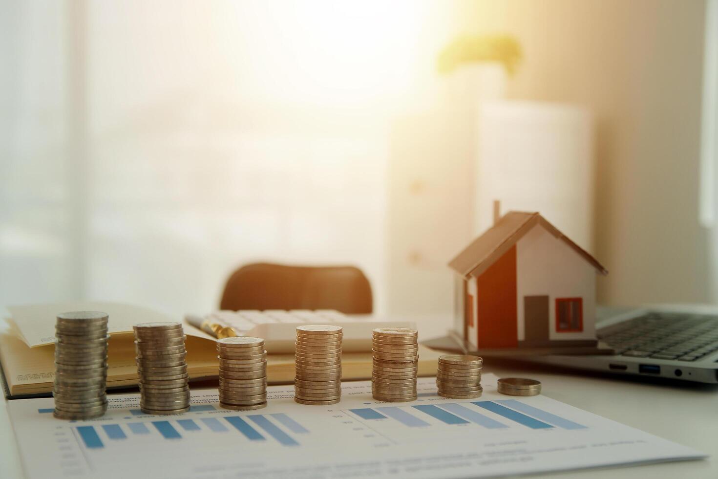 Saving money wealth concept, asian young business woman hand write management budget for saving cost, cash finance planning to spend enough money on her income for save money, payment tax, investing. photo