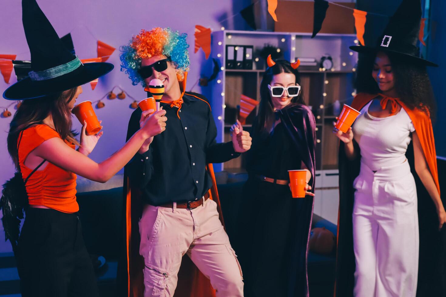 Joyful office Halloween party with coworkers in costumes, celebrating with drinks and laughter, fostering teamwork and festive spirit photo