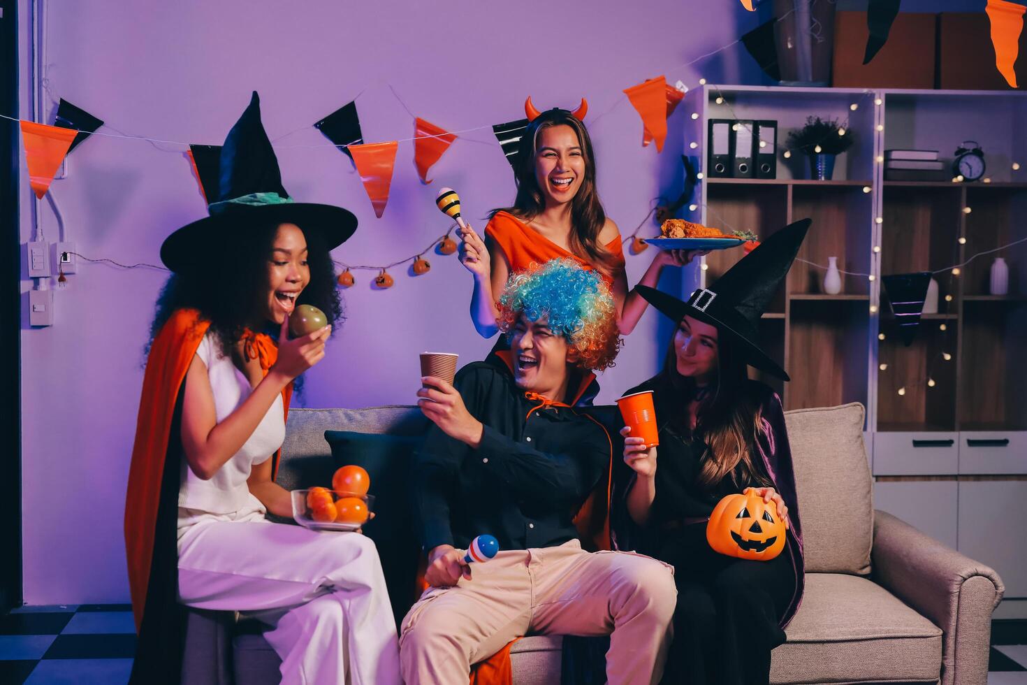 Joyful office Halloween party with coworkers in costumes, celebrating with drinks and laughter, fostering teamwork and festive spirit photo