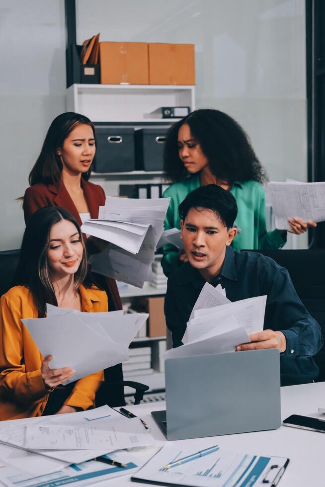Stress, business people and employee frustrated with multitasking, pressure or overworked by team in chaos with paperwork. Anxiety, headache and worker overwhelmed by group and burnout in crisis photo