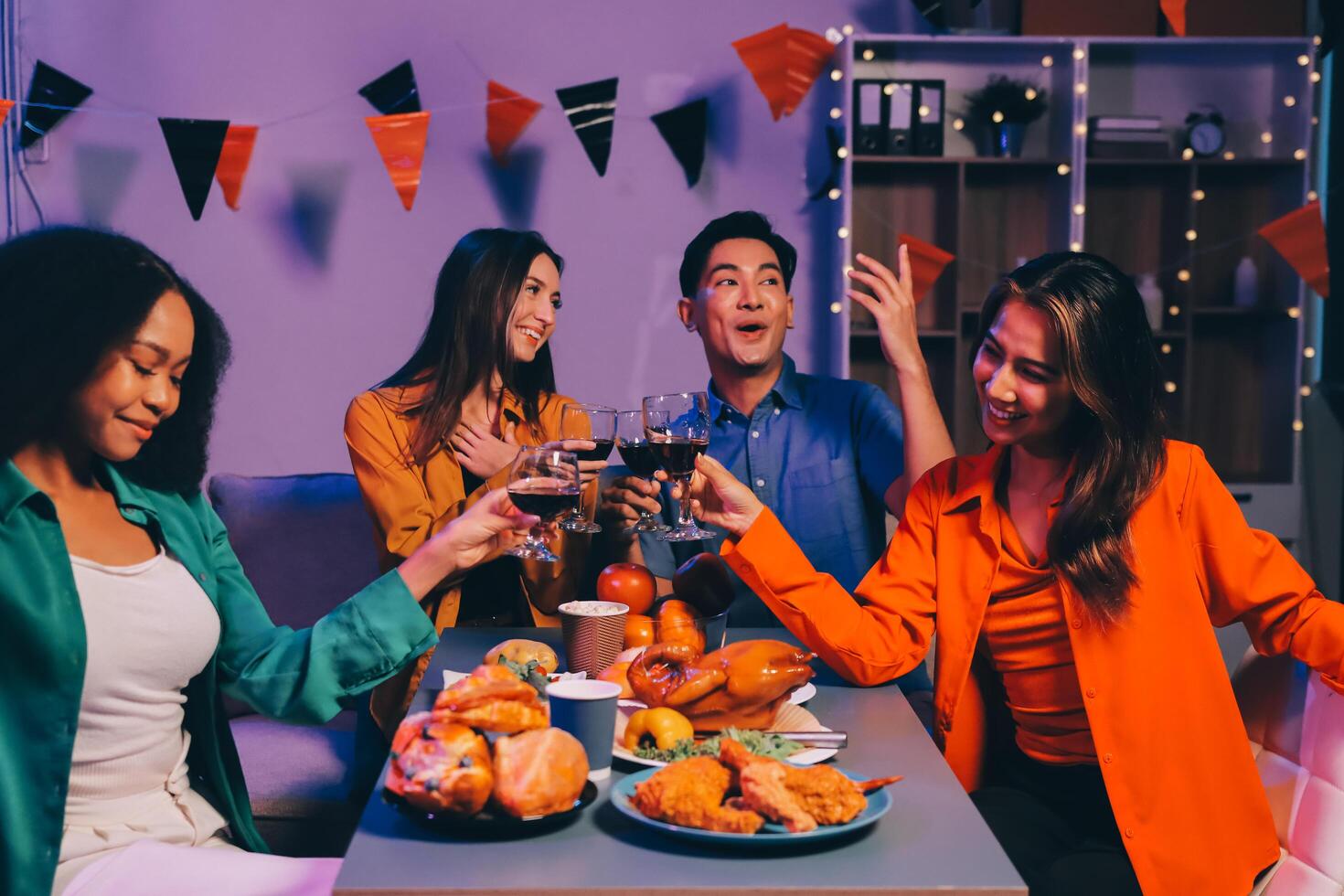 Joyful office Halloween party with coworkers in costumes, celebrating with drinks and laughter, fostering teamwork and festive spirit photo