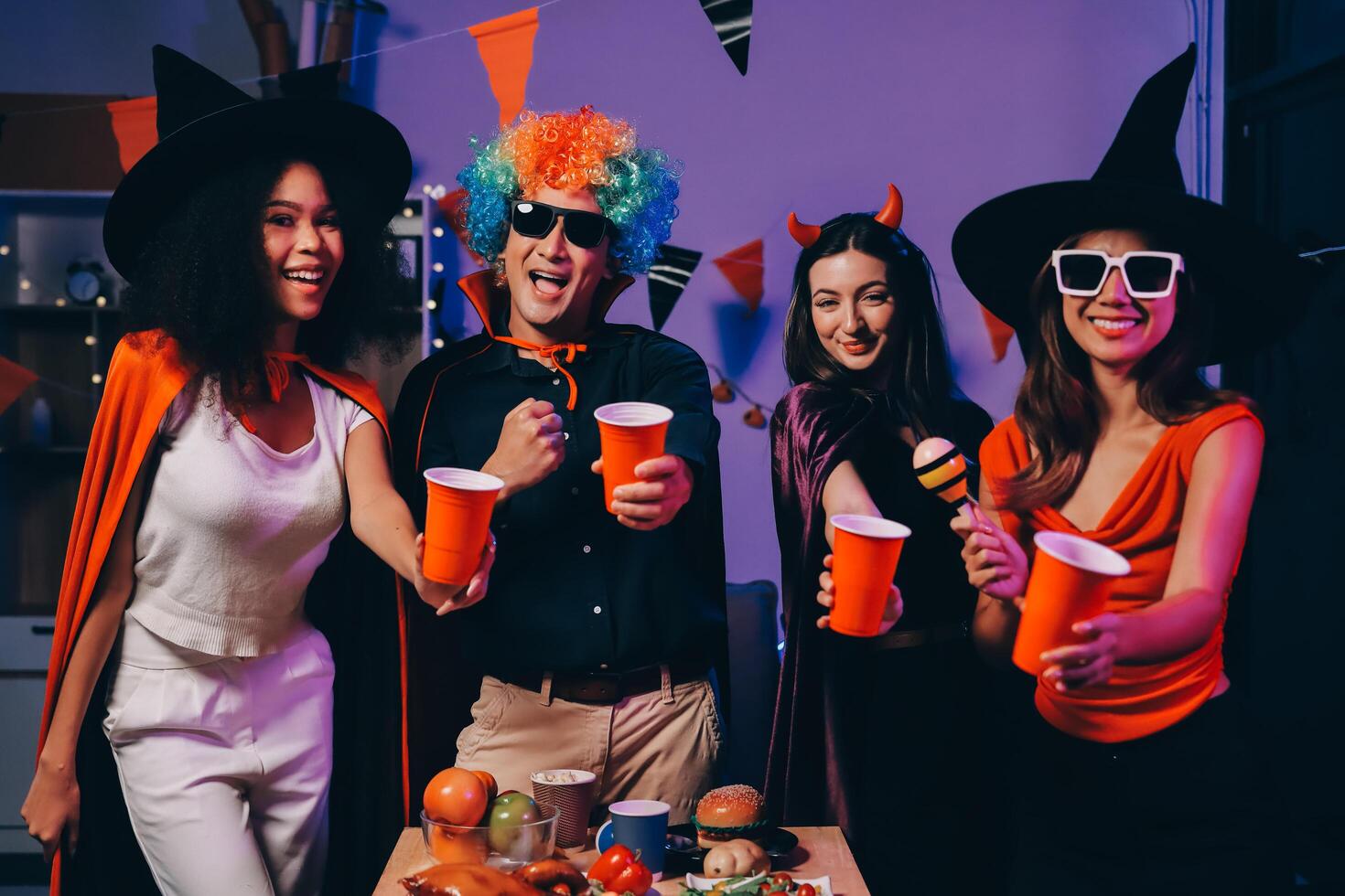 Joyful office Halloween party with coworkers in costumes, celebrating with drinks and laughter, fostering teamwork and festive spirit photo