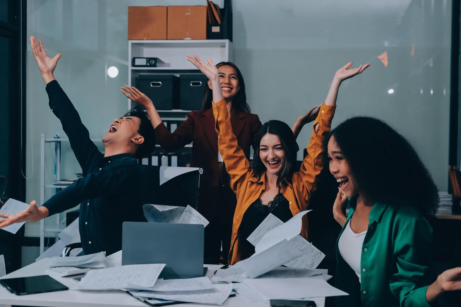 Motivated funny diverse business team people dancing celebrating success at corporate party on friday, happy friendly multiracial coworkers group having fun together enjoy victory dance in office photo