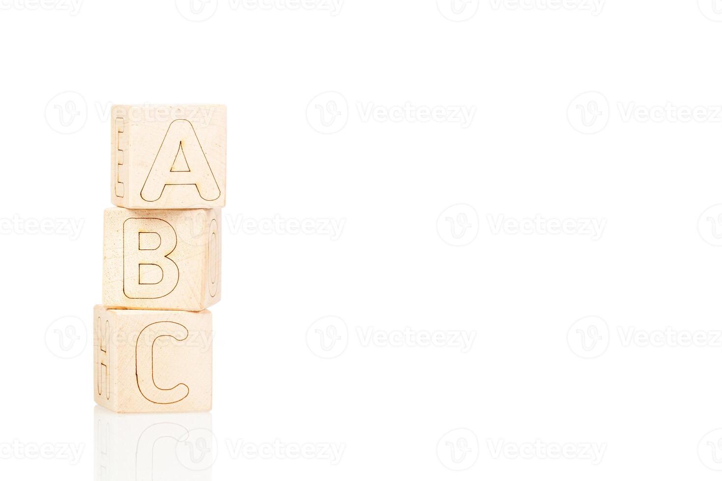 Wooden cubes with letters ABC on a white background photo