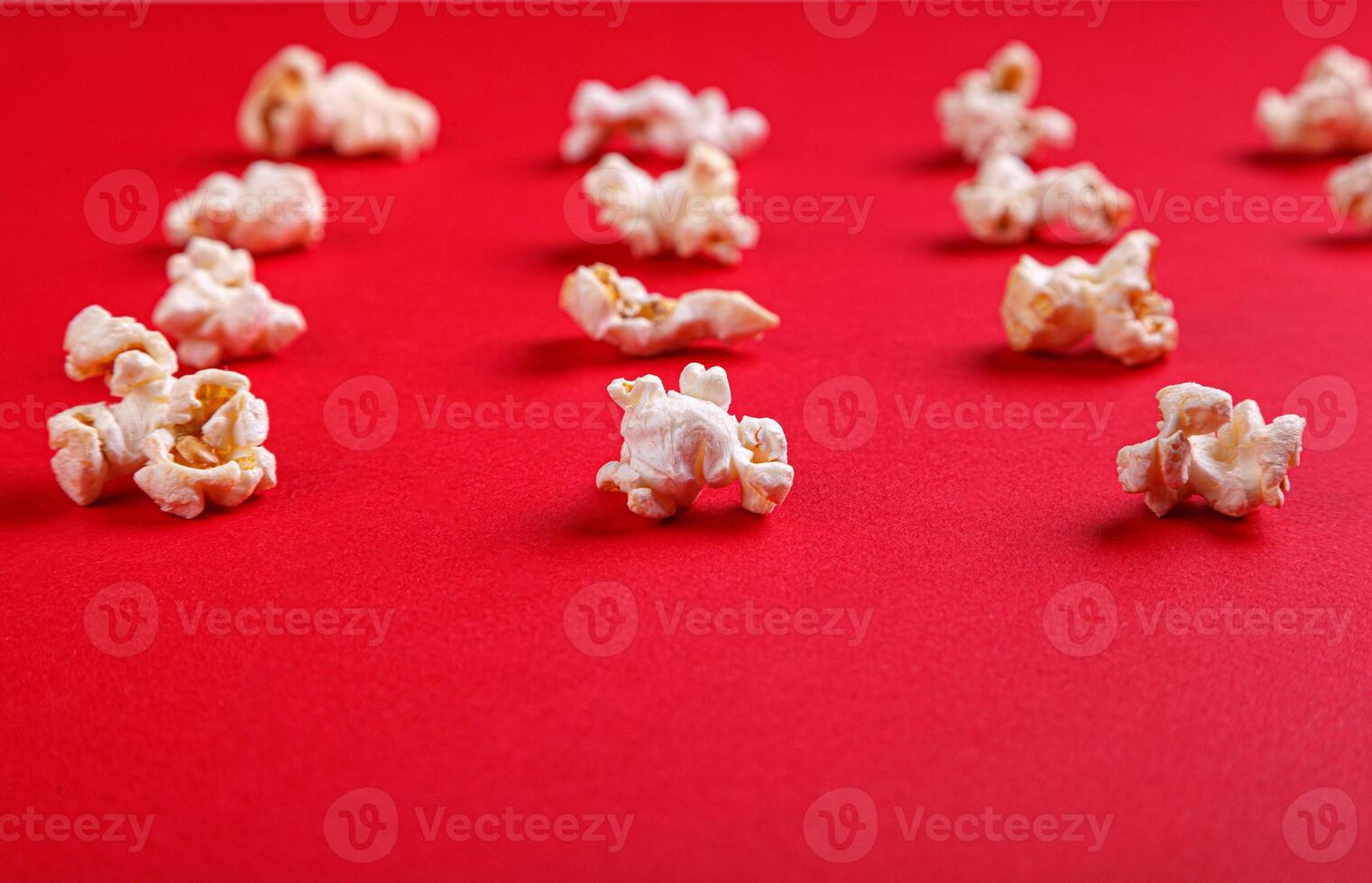 popcorn macro on a red background photo