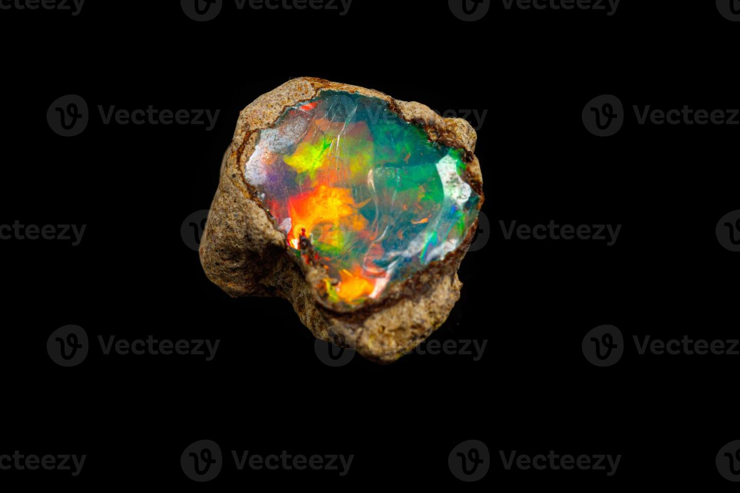 macro mineral stone rare and beautiful opals on a black background photo