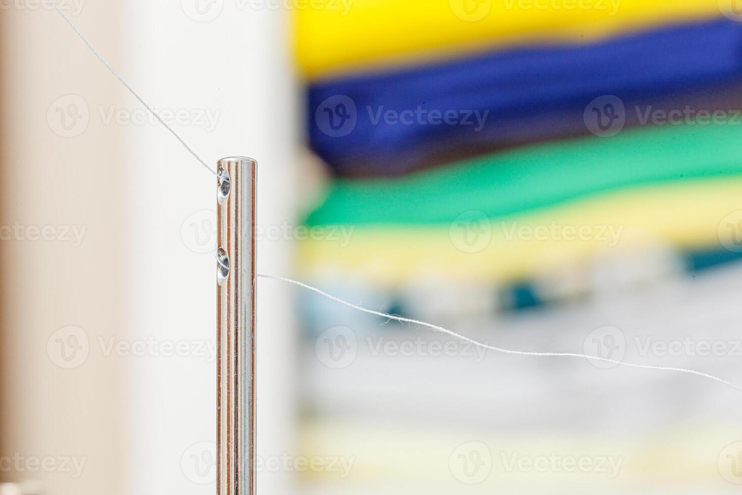 Details of a sewing machine, spool of thread photo