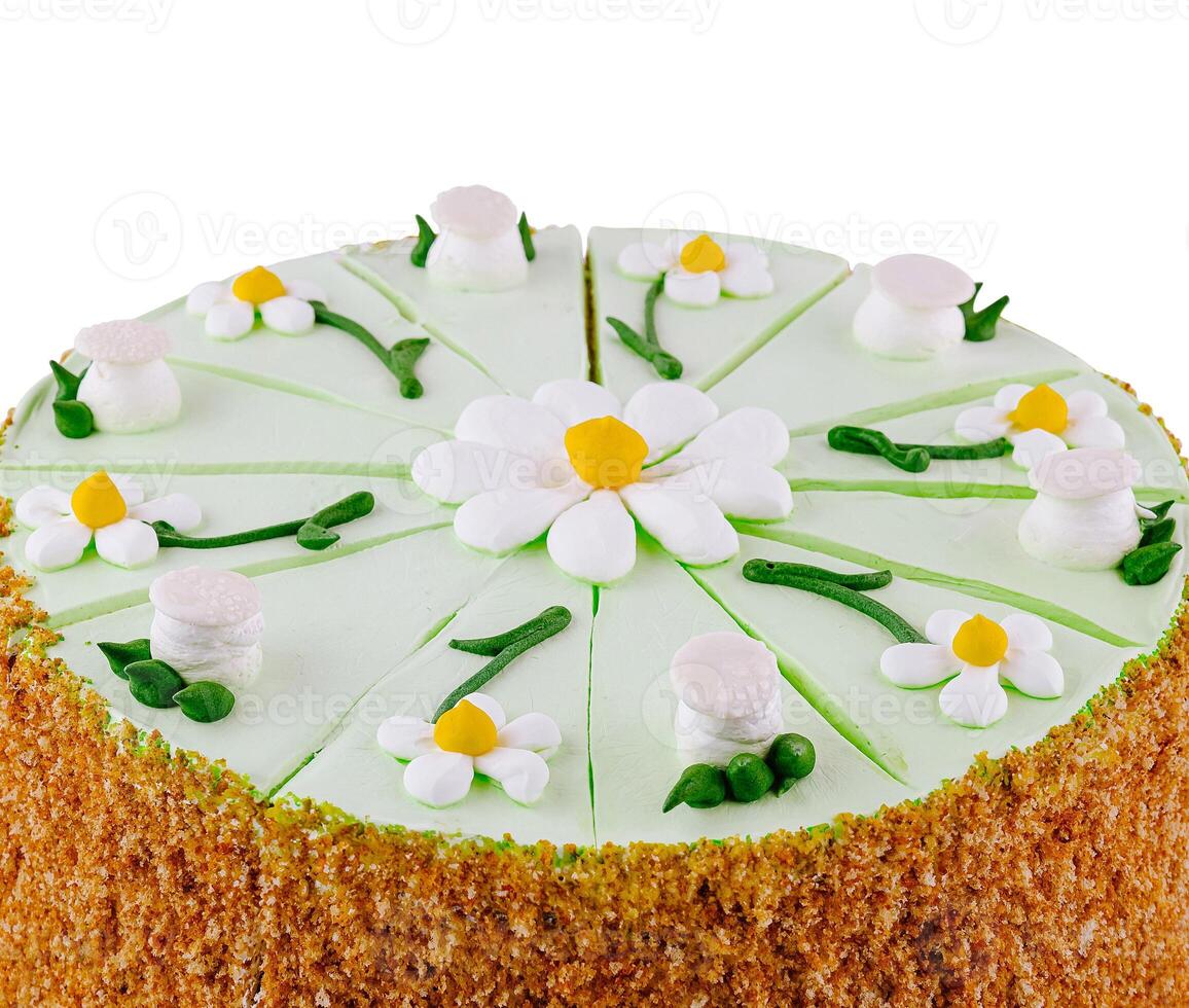 Delicious biscuit cake with butter cream and decorated with daisies being cut into slices photo