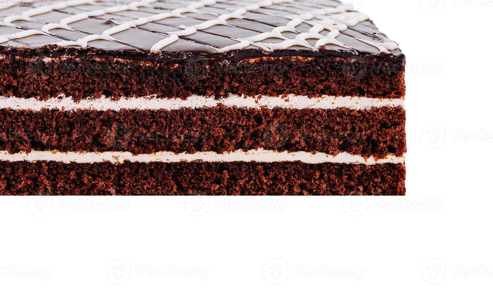 Delicious chocolate cake with white icing showing layers on white background photo