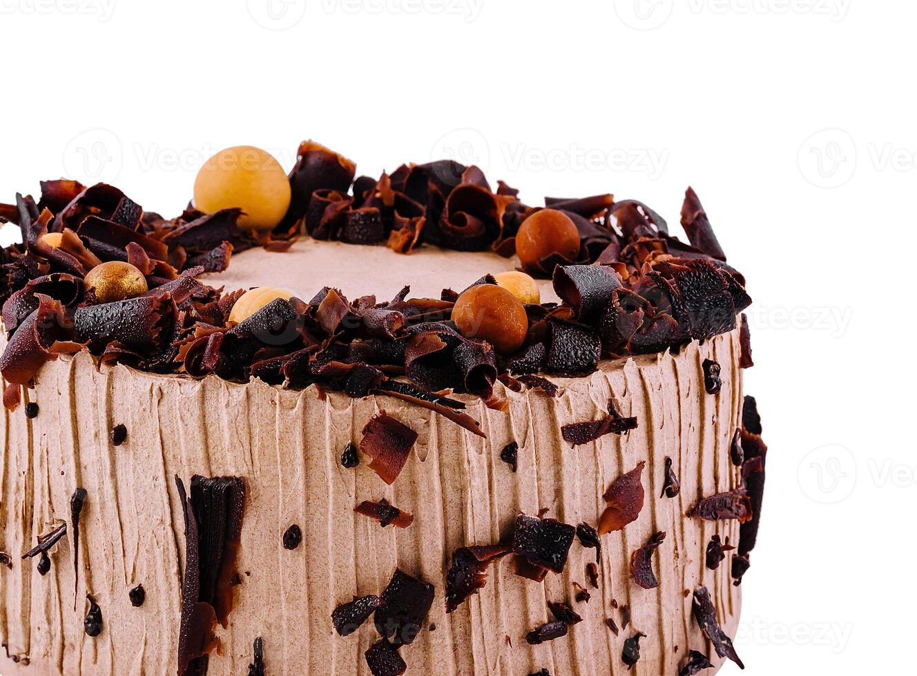 Delicious chocolate cake with chocolate shavings on white background photo