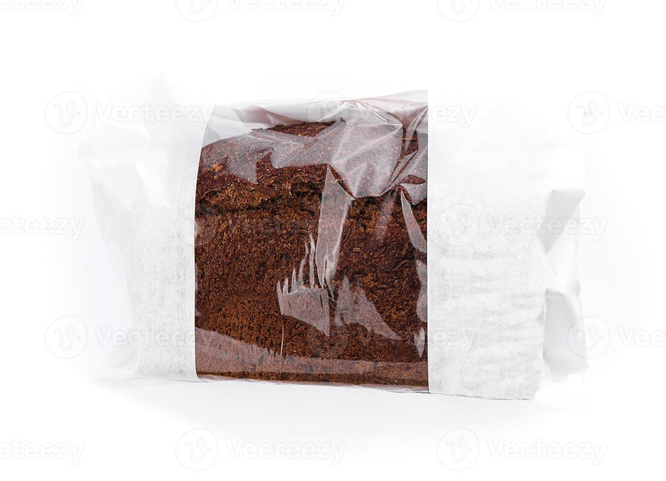 Freshly baked loaf of bread wrapped in plastic on white background photo