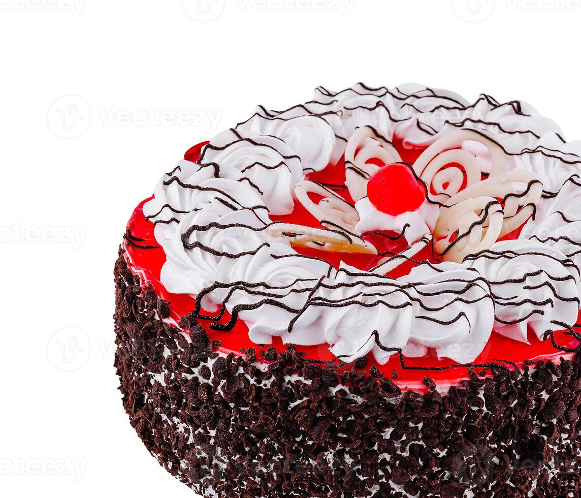 This delicious cake is decorated with frosting and a cherry on top photo