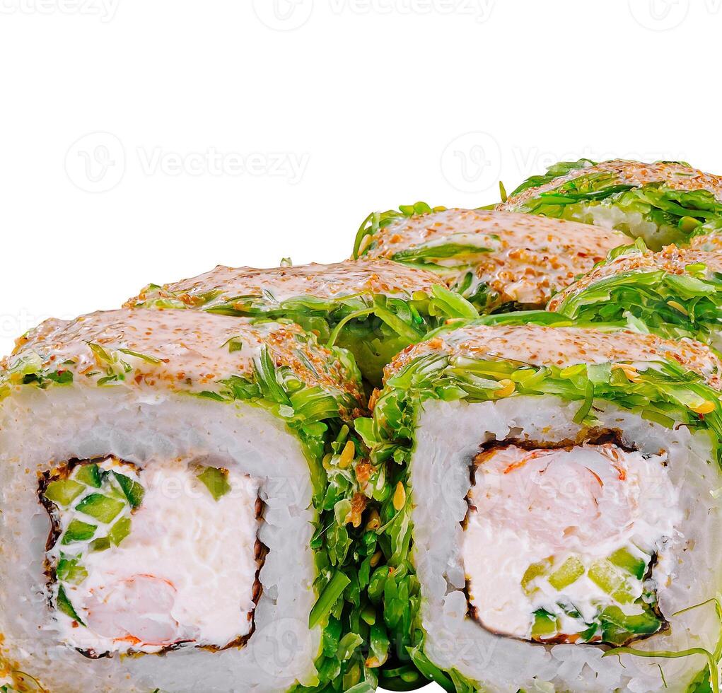 Green dragon sushi rolls with chuka seaweed decorated with sesame seeds on white background photo