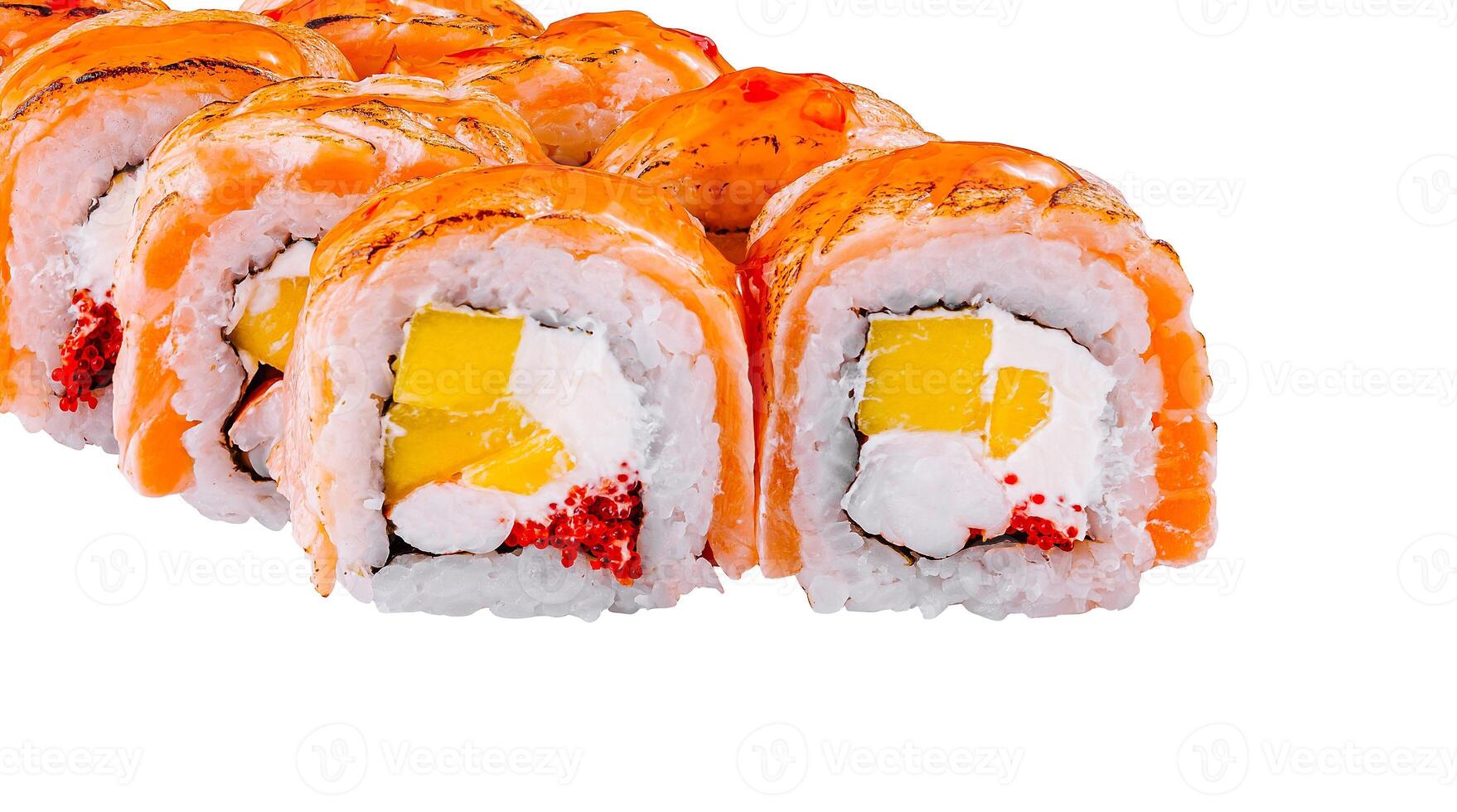 Sushi rolls with salmon and mango covered with sauce on white background photo