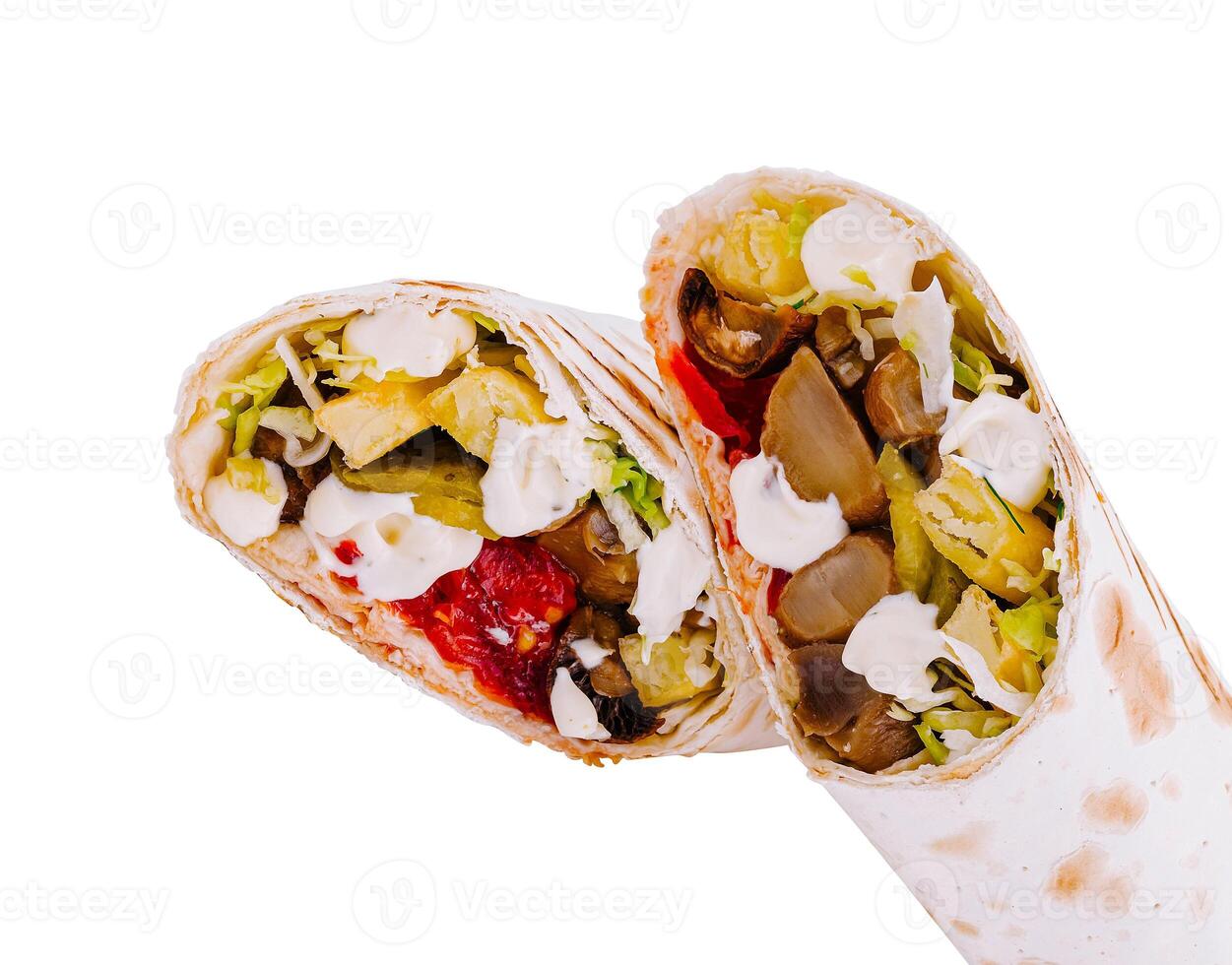 Delicious shawarma with fried potatoes, mushrooms and vegetables is lying on a white background photo