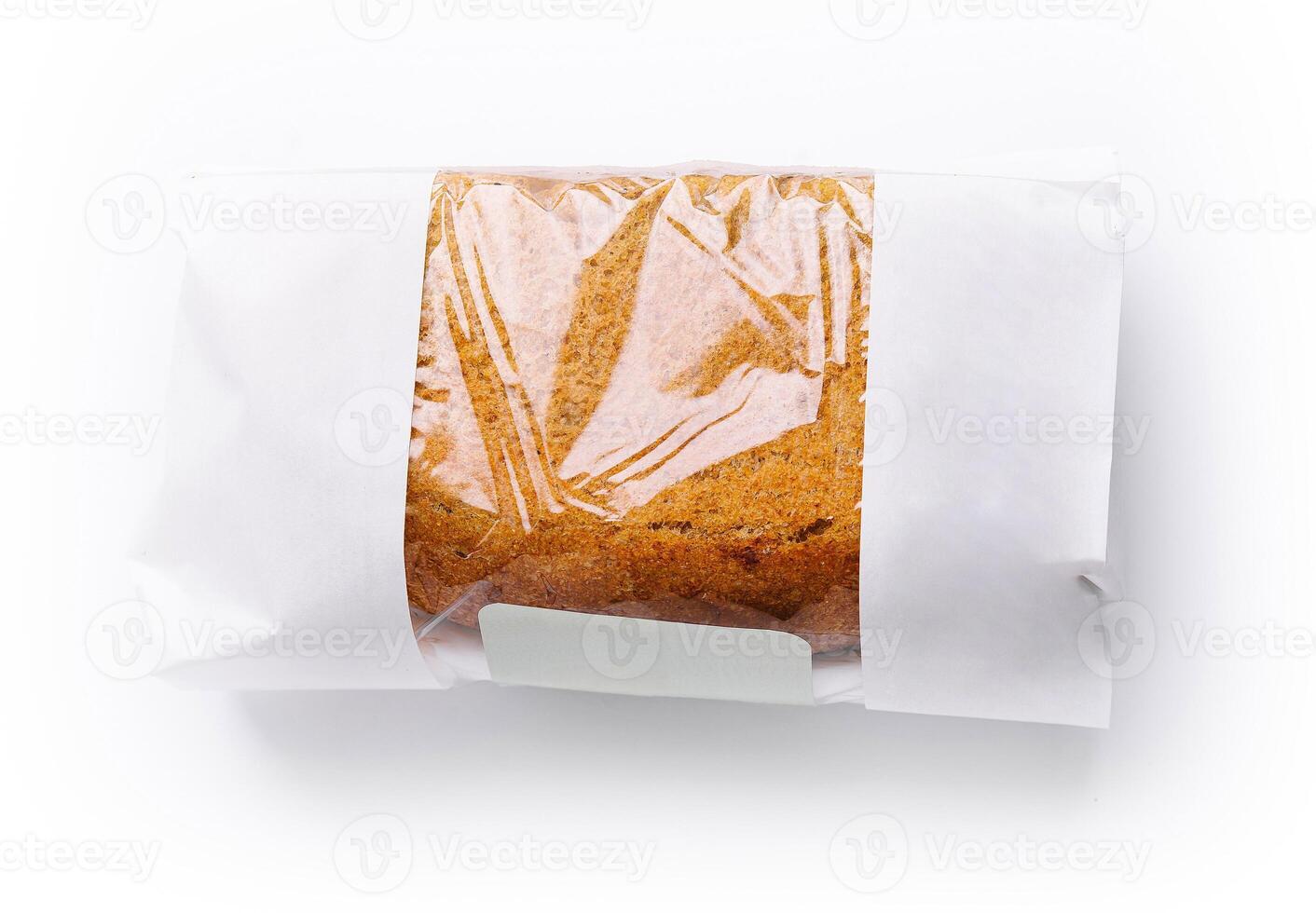 Freshly baked loaf of bread in minimalist packaging on white background photo